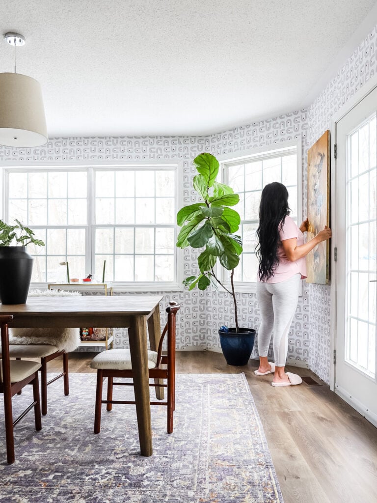 installing art in dining room