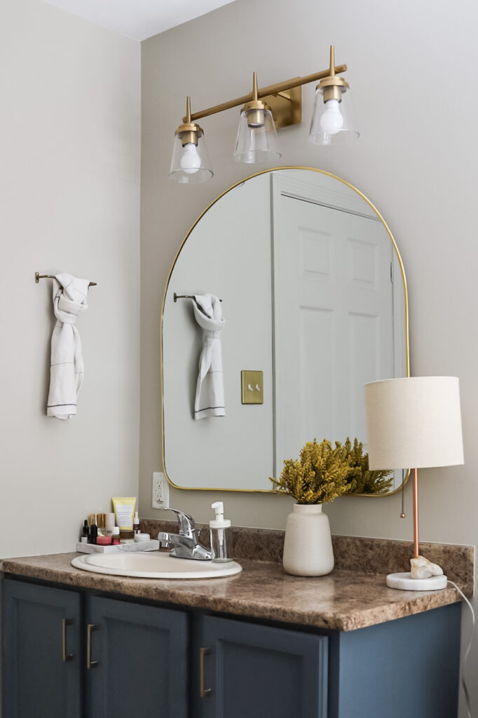 gold arched mirror